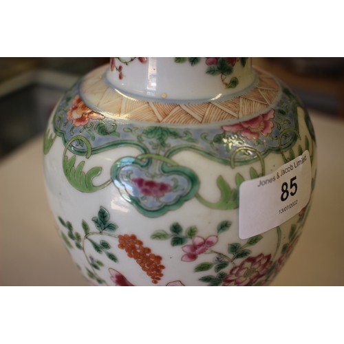 85 - A Chinese famille rose baluster vase with vase and flower decoration, ring mark to base, 8 1/4