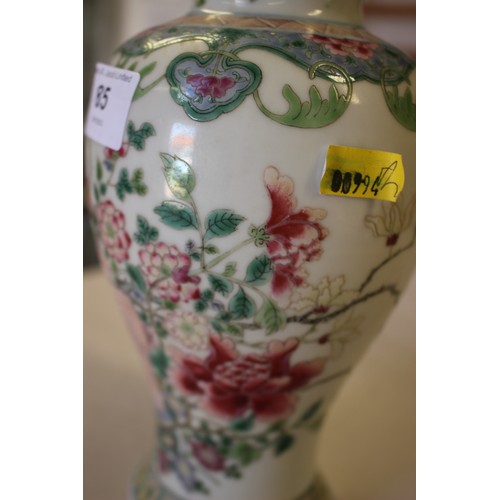 85 - A Chinese famille rose baluster vase with vase and flower decoration, ring mark to base, 8 1/4