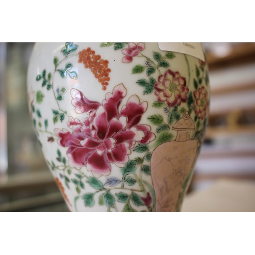 85 - A Chinese famille rose baluster vase with vase and flower decoration, ring mark to base, 8 1/4