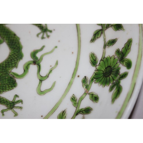 77 - A Chinese famille verte plate, decorated central dragon, flowers and foliage, 8