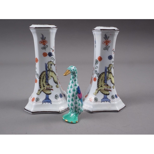 1 - A pair of Meissen candlesticks, decorated with mythical beast and flowers in a landscape, 4