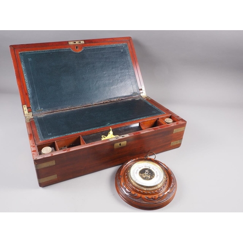 120 - A mahogany and brass mounted writing slope with green leather interior, 19 3/4