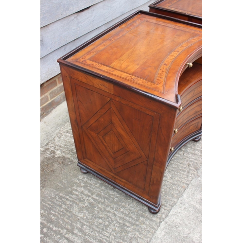 428 - A pair of Theodore Alexander cherrywood and burr walnut banded inverse bowfront bedside cabinets, fi... 