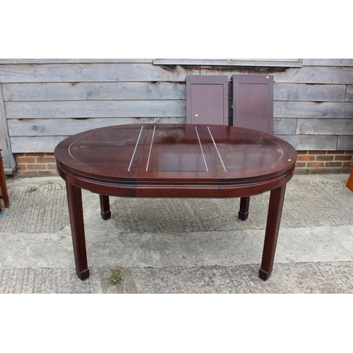 431 - A Chinese hardwood dining table, on square taper supports with three leaves, 96