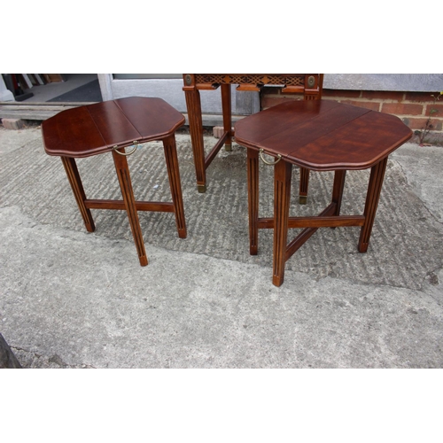 434 - A mahogany and ash banded nest of three occasional table, on reeded supports and brass feet, 20