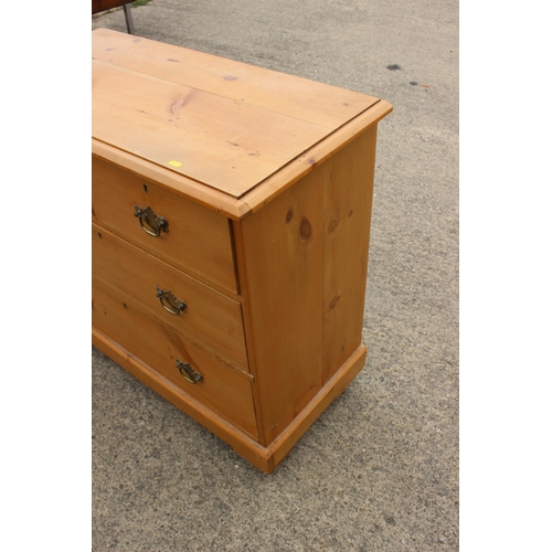 451 - A waxed pine chest of two short and two long drawers with brass handle plates, 34