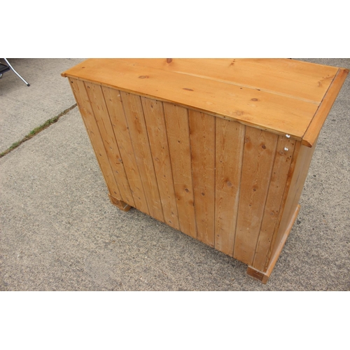 451 - A waxed pine chest of two short and two long drawers with brass handle plates, 34