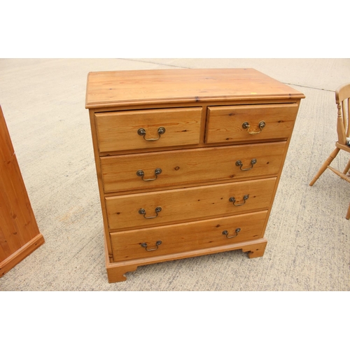 452 - A waxed pine chest of two short and three long drawers with brass bail handles, on bracket feet 36