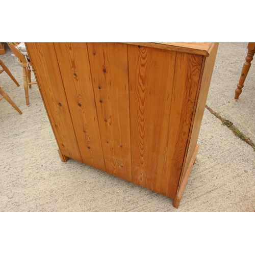 452 - A waxed pine chest of two short and three long drawers with brass bail handles, on bracket feet 36