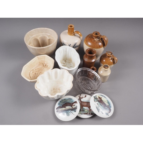 66 - An early Copeland jelly mould, four other jelly moulds, stoneware jugs, and three pot lids, decorate... 