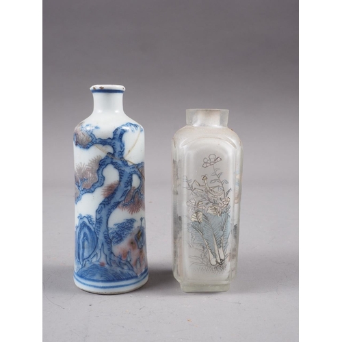 82 - A Chinese blue, white and iron oxide glazed scent bottle with landscape decoration, 3 1/8