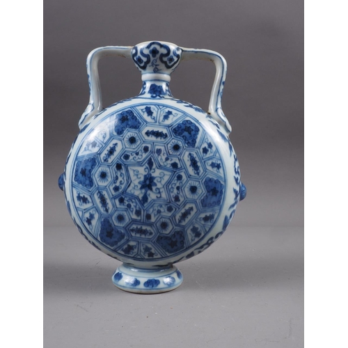 83 - A Chinese blue and white flared rim vase, decorated with two figures carrying an urn and birds and f... 