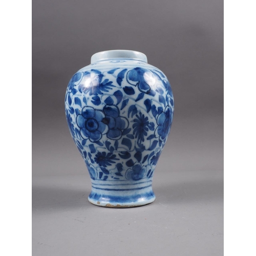 83 - A Chinese blue and white flared rim vase, decorated with two figures carrying an urn and birds and f... 