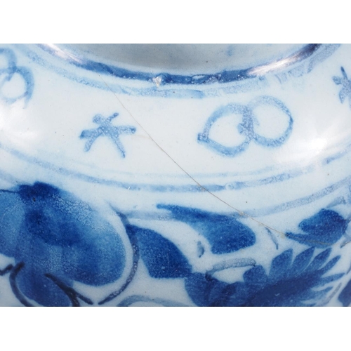 83 - A Chinese blue and white flared rim vase, decorated with two figures carrying an urn and birds and f... 