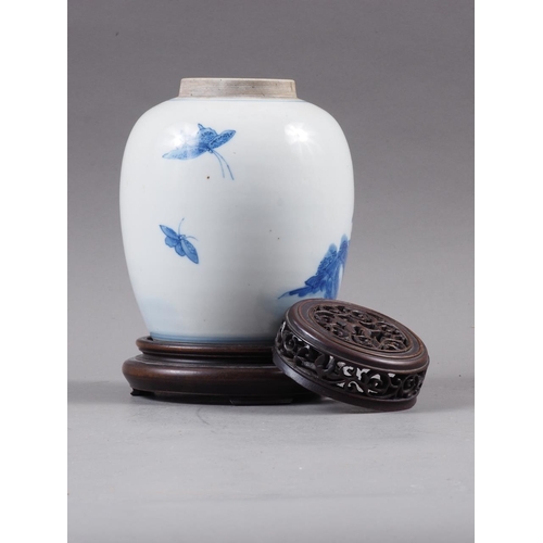 91 - A Chinese blue and white floral bird decorated pot-pourri jar with pierced hardwood cover and stand,... 