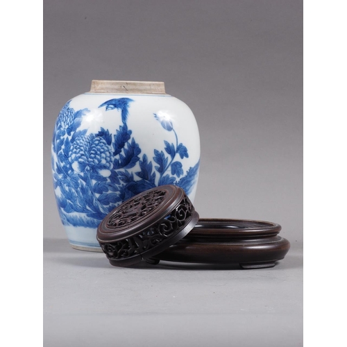 91 - A Chinese blue and white floral bird decorated pot-pourri jar with pierced hardwood cover and stand,... 