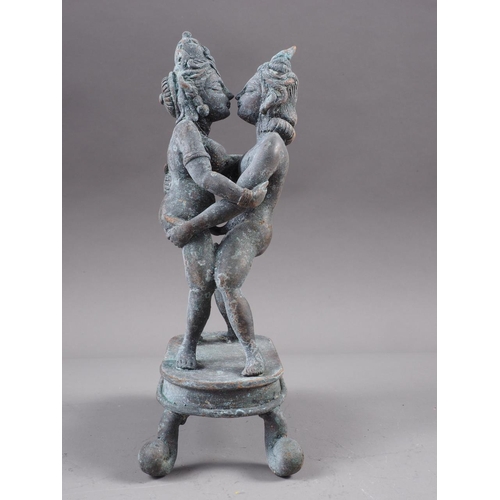 93 - A Far Eastern bronze, figures embracing, 8