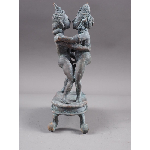 93 - A Far Eastern bronze, figures embracing, 8