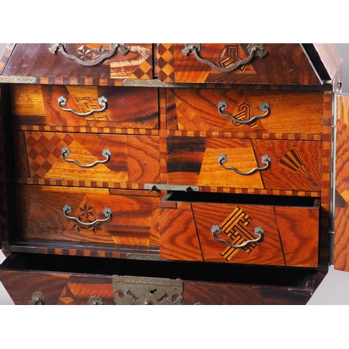 95 - A 19th century japanned cabinet with hinged top over two shaped drawers, fitted interior enclosed bi... 