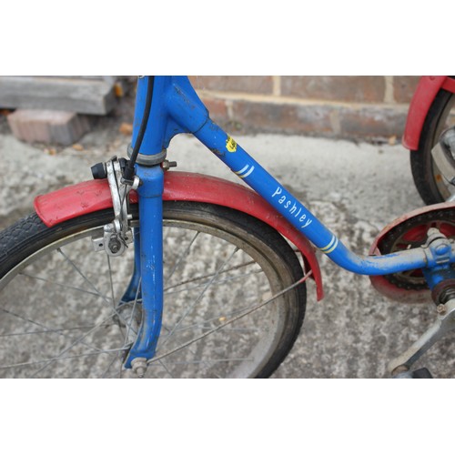 460 - A child's Pashley tricycle, in blue and red, 29 1/4