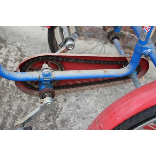 460 - A child's Pashley tricycle, in blue and red, 29 1/4