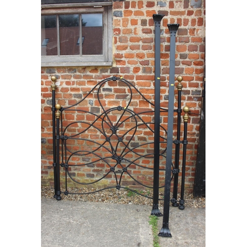 445 - A wrought iron and brass double bed frame, 53