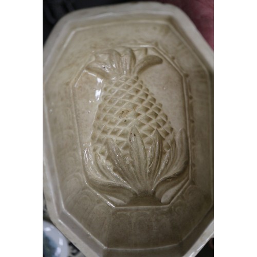 66 - An early Copeland jelly mould, four other jelly moulds, stoneware jugs, and three pot lids, decorate... 