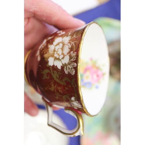 71 - A quantity of china, including a crimson and gilt decorated part combination service, a Dresden cup ... 