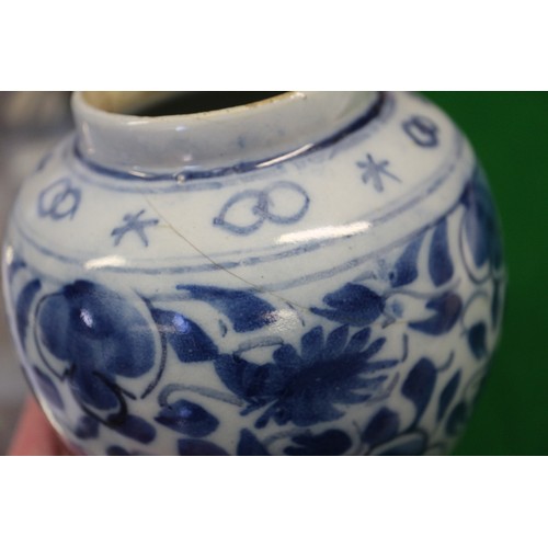 83 - A Chinese blue and white flared rim vase, decorated with two figures carrying an urn and birds and f... 