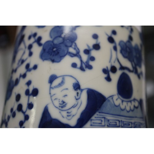 83 - A Chinese blue and white flared rim vase, decorated with two figures carrying an urn and birds and f... 