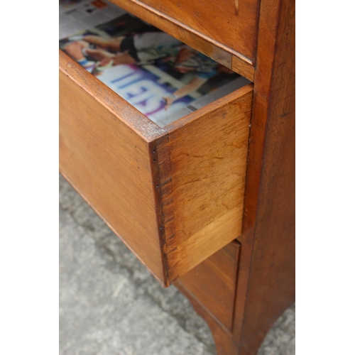 411 - An early 19th century mahogany linen press, the upper section enclosed two doors, over two faux draw... 