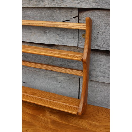 503 - An Ercol elm open plate rack, 38