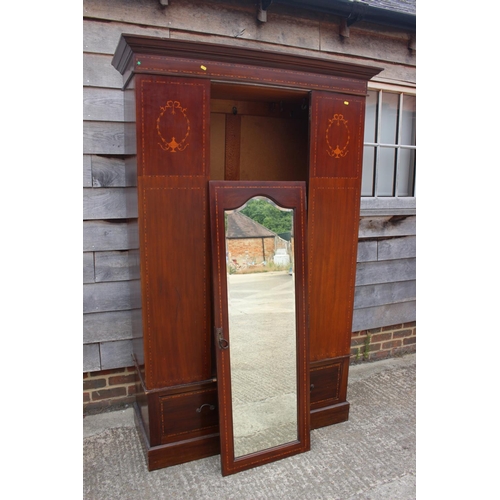 508 - An Edwardian mahogany and inlaid bedroom suite, comprising a wardrobe enclosed mirror door over one ... 