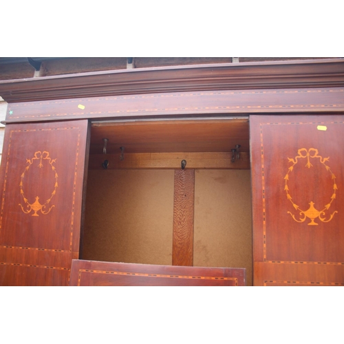 508 - An Edwardian mahogany and inlaid bedroom suite, comprising a wardrobe enclosed mirror door over one ... 