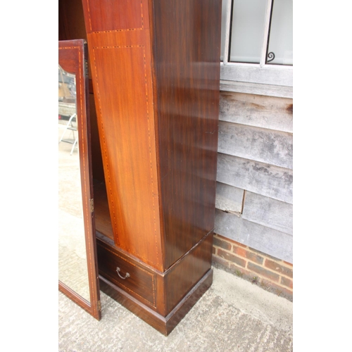 508 - An Edwardian mahogany and inlaid bedroom suite, comprising a wardrobe enclosed mirror door over one ... 