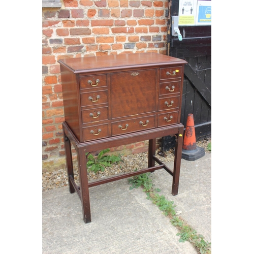 527 - A mahogany drinks cabinet of Georgian design with fall front, on stand with chamfered supports, 32