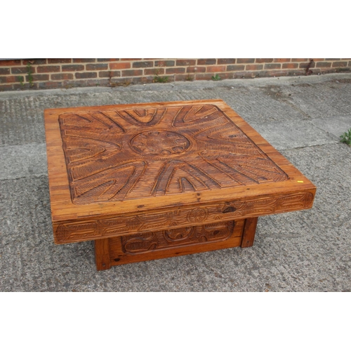 528 - An African? carved hardwood square shaped coffee table, on block base, 42