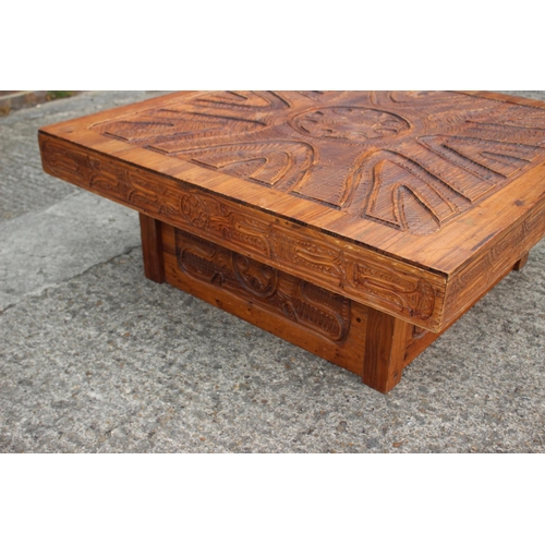 528 - An African? carved hardwood square shaped coffee table, on block base, 42