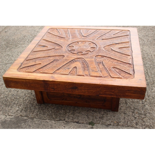 528 - An African? carved hardwood square shaped coffee table, on block base, 42