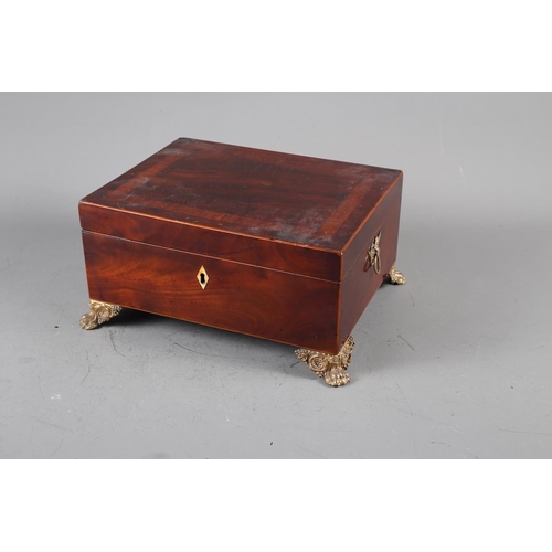 135 - A mahogany and banded jewellery box with brass handles, on paw supports, 11