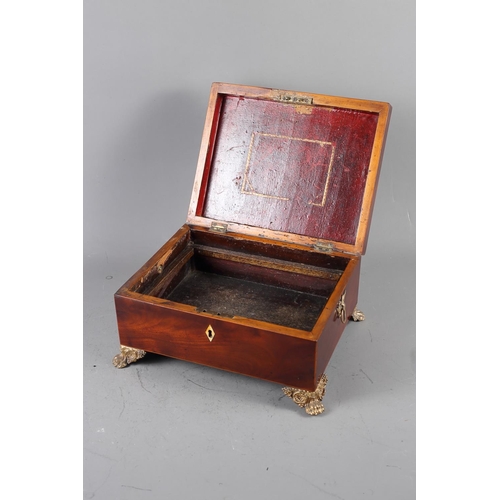 135 - A mahogany and banded jewellery box with brass handles, on paw supports, 11