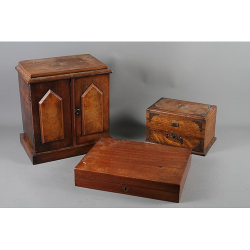 140 - A 19th century mahogany two door cabinet with three drawers, 12