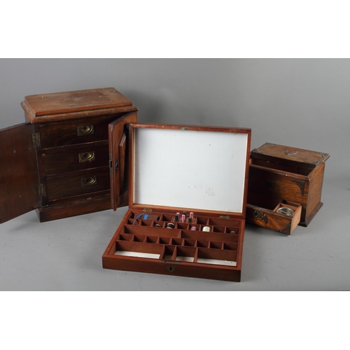 140 - A 19th century mahogany two door cabinet with three drawers, 12