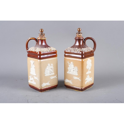 15 - A pair of Doulton sprigged stoneware spirit decanters and stoppers (damages), two similar coffee pot... 