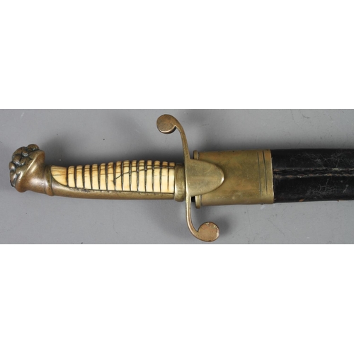 153 - A midshipman's mid 19th century dirk with carved grip, brass cross guard and mask pommel, blade stam... 