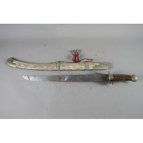 156 - A Oriental sword with shagreen sheath and brass mounts, 18 1/2