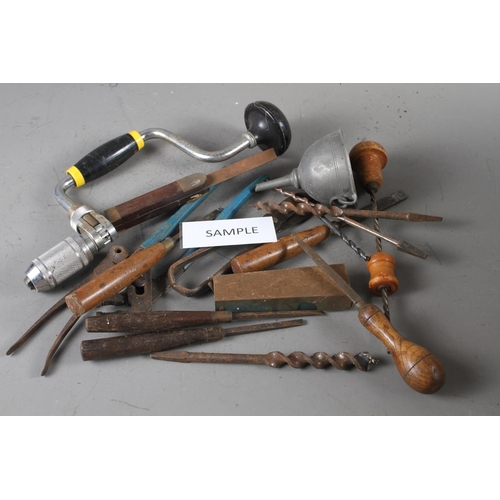 175 - A quantity of vintage and earlier tools, including manual drills, pliers, drill bits, etc