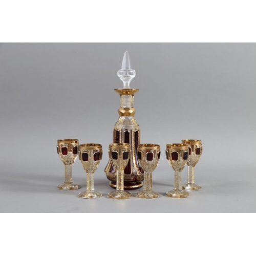 23 - An Austrian overlaid cut and gilt glass liqueur set, in case