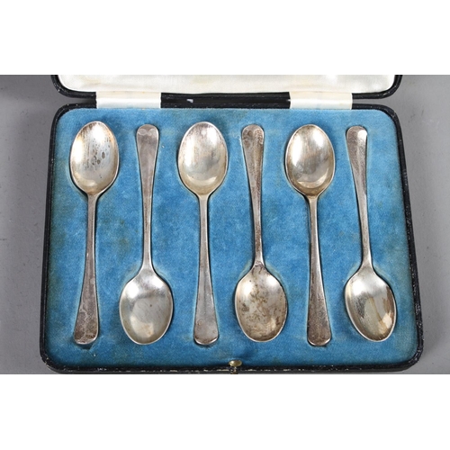 245 - A set of six Walker & Hall silver teaspoons, boxed, 3.9oz troy approx