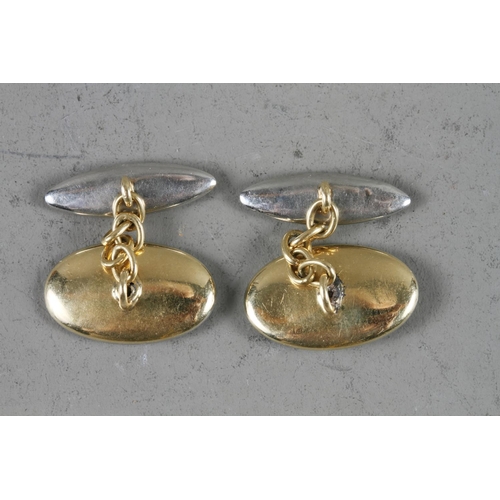 261 - A pair of yellow and white metal, mother-of-pearl, onyx and diamond cufflinks, 6.5g